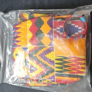 Brand new African print mini dress, multi color design detail on the shoulders